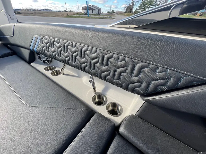 Slide: The Image of 2024 Regal LS6 Surf interior with stylish upholstery and cup holders. - 11