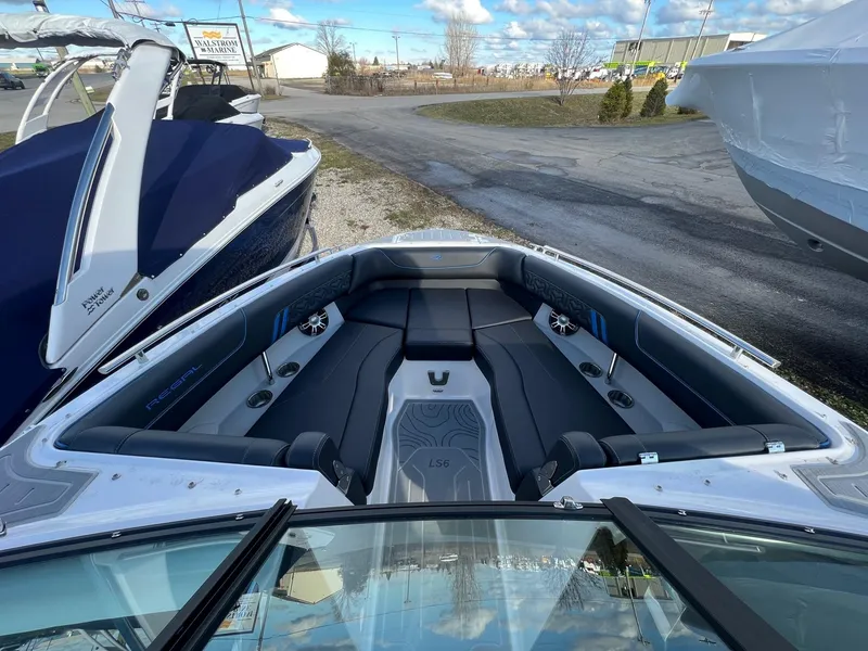 Slide: The Image of 2024 Regal LS6 Surf boat interior with sleek seating and modern design. - 18