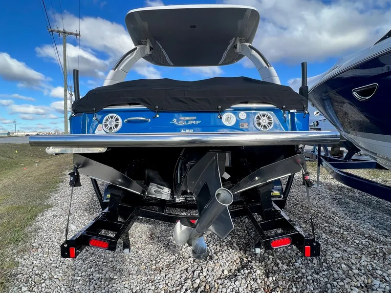 Slide: The Image of 2024 Regal LS6 Surf boat rear view with propeller and cover. - 5