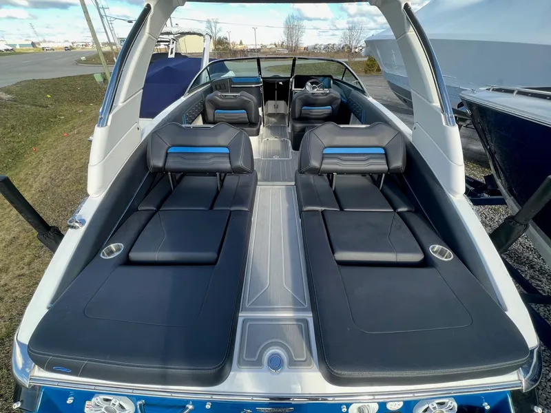 Slide: The Image of 2024 Regal LS6 Surf boat interior with luxurious seating and sleek design. - 7