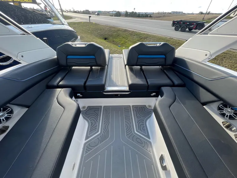 Slide: The Image of 2024 Regal LS6 Surf boat interior with sleek seating and modern design. - 9
