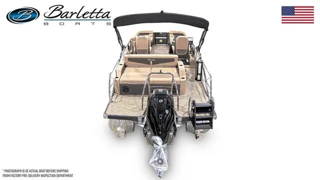 Slide: The Image of 2024 Barletta Boats Cabrio C22UC pontoon boat, rear view with motor and seating. - 3