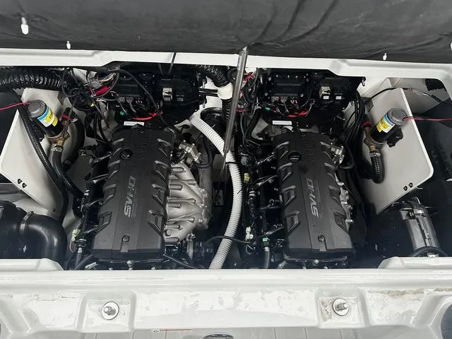 Slide: The Image of 2024 Yamaha Boats 255XD twin engines in engine compartment. - 11