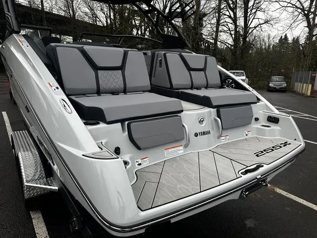 Slide: The Image of 2024 Yamaha Boats 255XD rear view with seating and swim platform. - 3