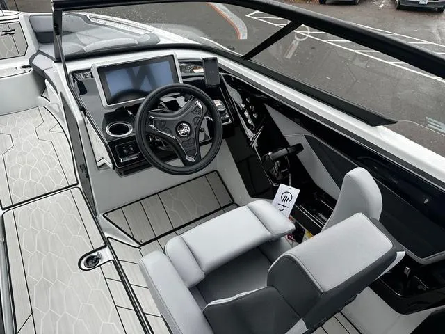Slide: The Image of 2024 Yamaha Boats 255XD cockpit with modern dashboard and steering wheel. - 8