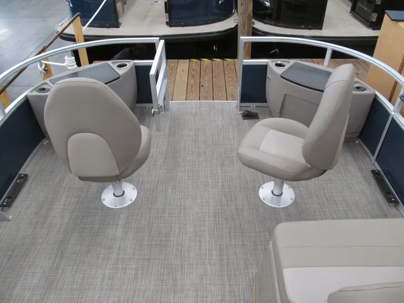 Slide: The Image of 2024 Ranger Reata 200F boat interior with two swivel seats and carpeted deck. - 12
