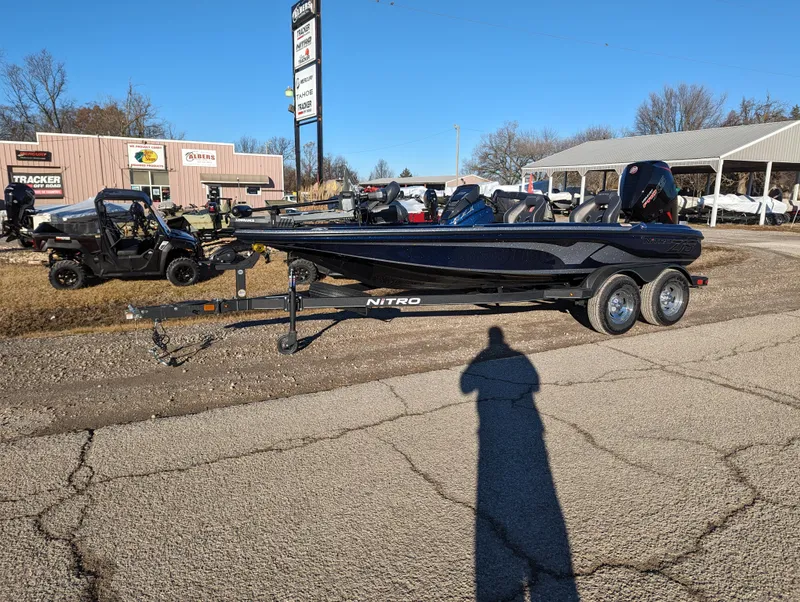 Slide: The Image of 2024 Nitro Z18 Pro boat on trailer in outdoor dealership lot. - 0