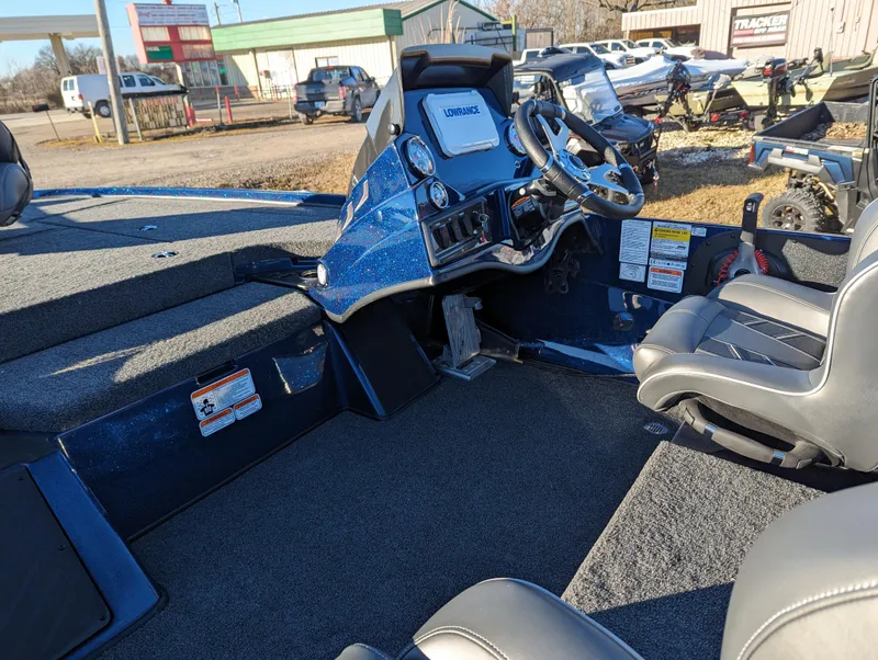 Slide: The Image of 2024 Nitro Z18 Pro boat interior with steering console and seating. - 11