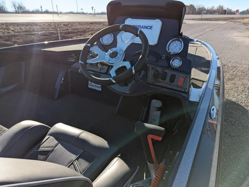 Slide: The Image of 2024 Nitro Z18 Pro boat cockpit with steering wheel and gauges. - 14
