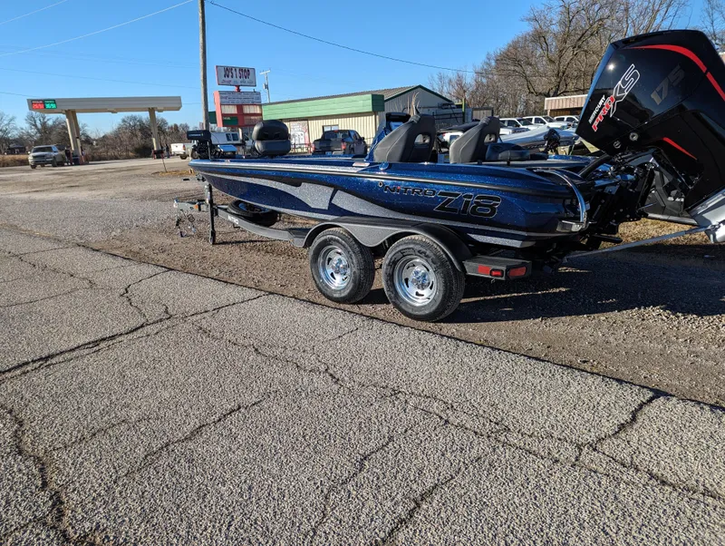 Slide: The Image of 2024 Nitro Z18 Pro boat on trailer in parking lot. - 2
