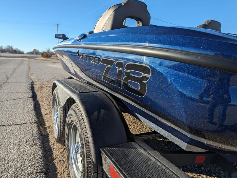 Slide: The Image of 2024 Nitro Z18 Pro boat on trailer, blue finish, parked on roadside. - 3