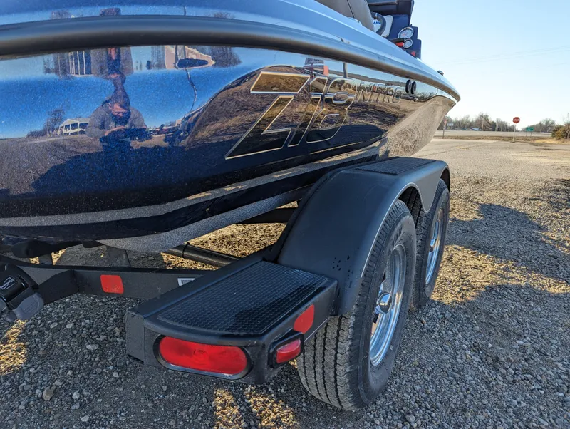 Slide: The Image of 2024 Nitro Z18 Pro boat on trailer, shiny black finish, dual wheels. - 5