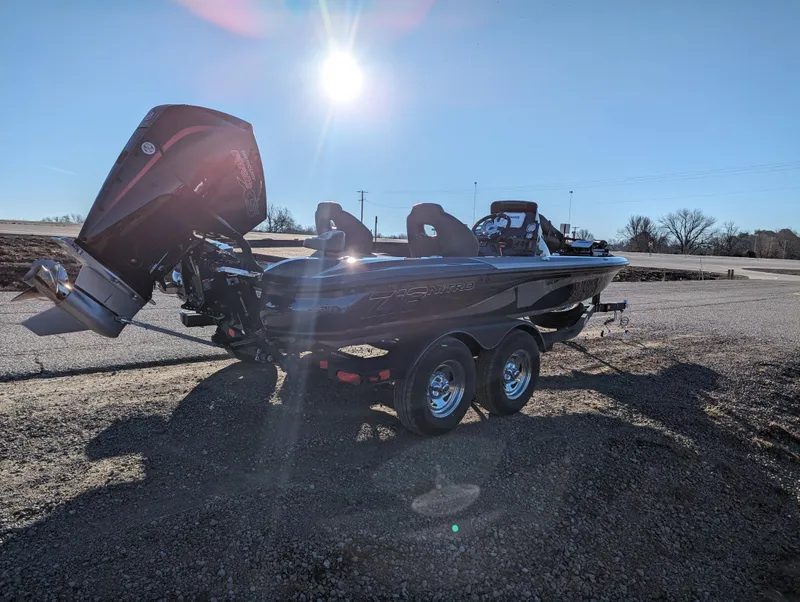 Slide: The Image of 2024 Nitro Z18 Pro boat on trailer under bright sun. - 6