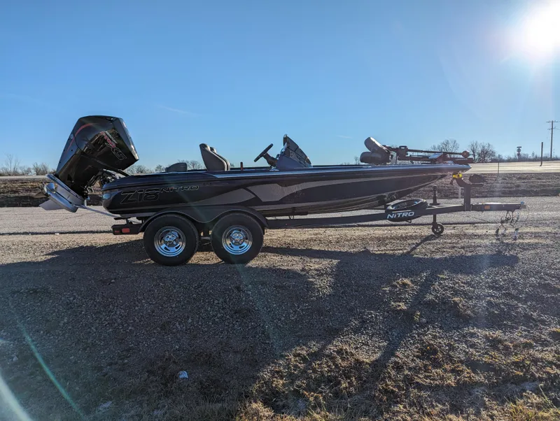 Slide: The Image of 2024 Nitro Z18 Pro fishing boat on trailer in sunny outdoor setting. - 7