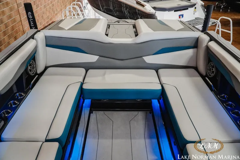 Slide: The Image of 2022 Axis T250 boat interior with blue LED lighting and spacious seating. - 15
