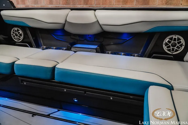 Slide: The Image of Axis T250 2022 boat interior with blue LED lighting and cushioned seating. - 18