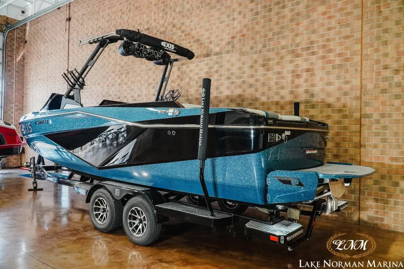 Slide: The Image of 2022 Axis T250 boat on trailer at Lake Norman Marina. - 2