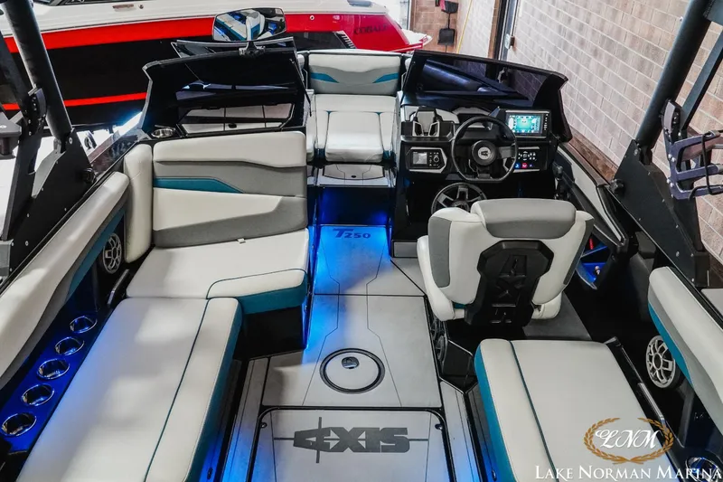 Slide: The Image of 2022 Axis T250 boat interior with modern seating and advanced dashboard at Lake Norman Marina. - 8