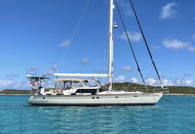 The Image of 2003 Taswell 58 sailboat anchored in clear blue water under a sunny sky. - 0