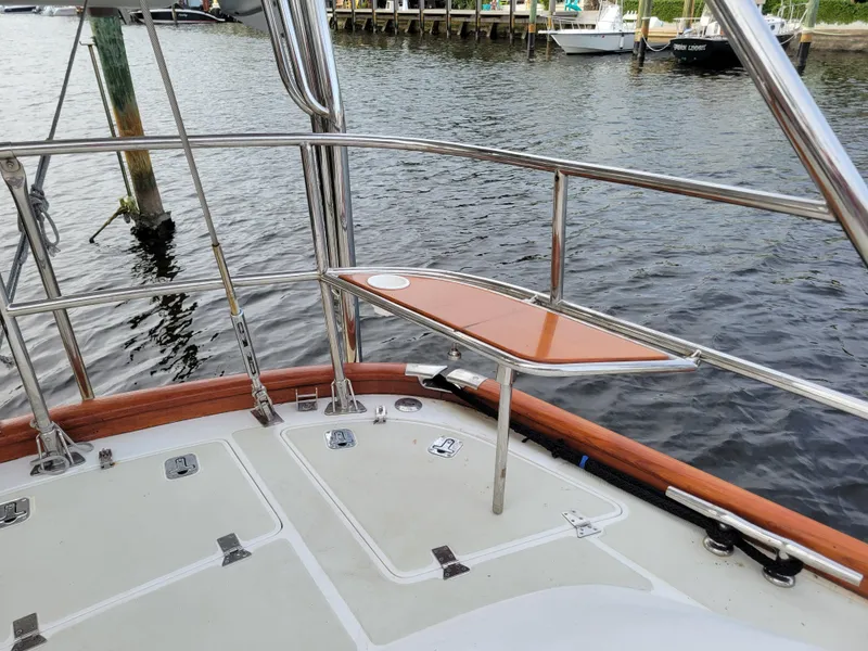 Slide: The Image of Deck of 2003 Taswell 58 yacht with polished railings and wooden accents. - 11