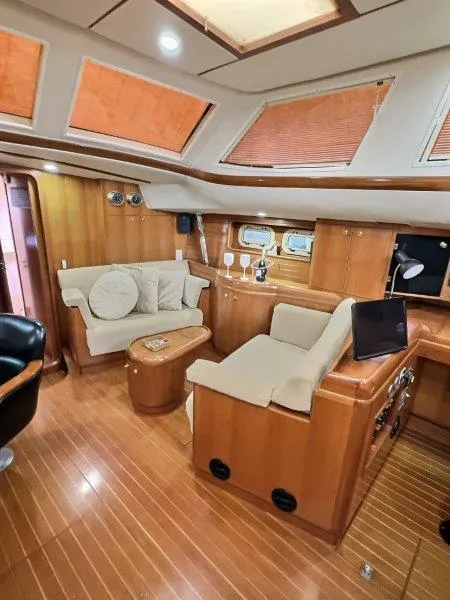 Slide: The Image of Luxurious 2003 Taswell 58 yacht interior with elegant wood finish and comfortable seating. - 16