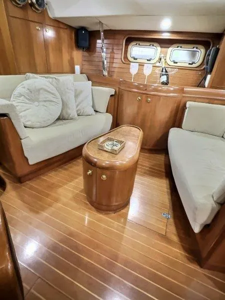 Slide: The Image of Luxurious 2003 Taswell 58 yacht interior with elegant wood finish and cozy seating area. - 17