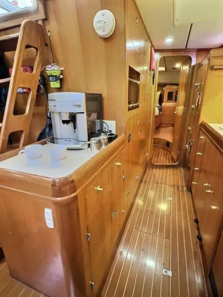 Slide: The Image of Interior of 2003 Taswell 58 yacht with wooden cabinetry and modern appliances. - 18