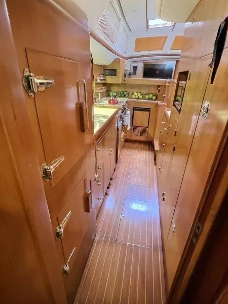 Slide: The Image of Interior of 2003 Taswell 58 yacht with wooden cabinetry and modern amenities. - 23