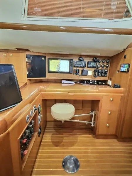 Slide: The Image of Navigation station of 2003 Taswell 58 yacht with wooden interior and advanced equipment. - 24
