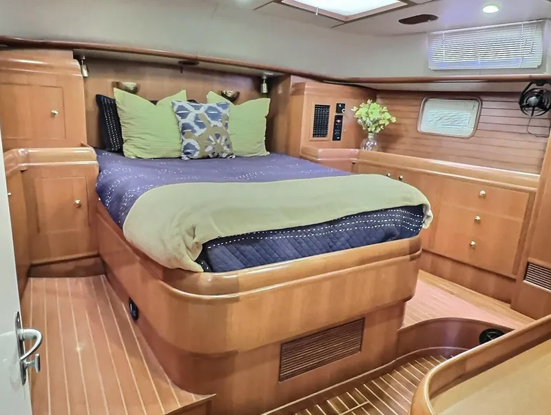 Slide: The Image of Luxurious Taswell 58 yacht bedroom interior with wooden finish, 2003 model. - 27