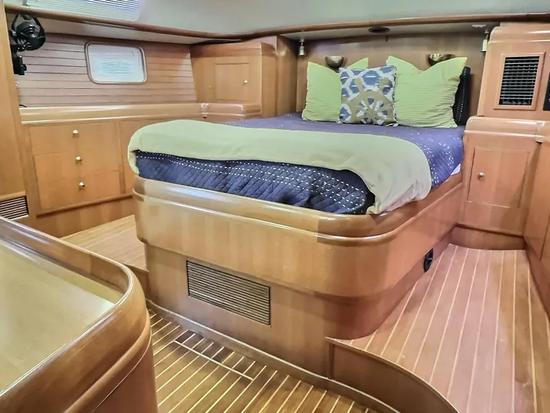 Slide: The Image of Luxurious Taswell 58 yacht bedroom interior with wooden finish, 2003 model. - 28