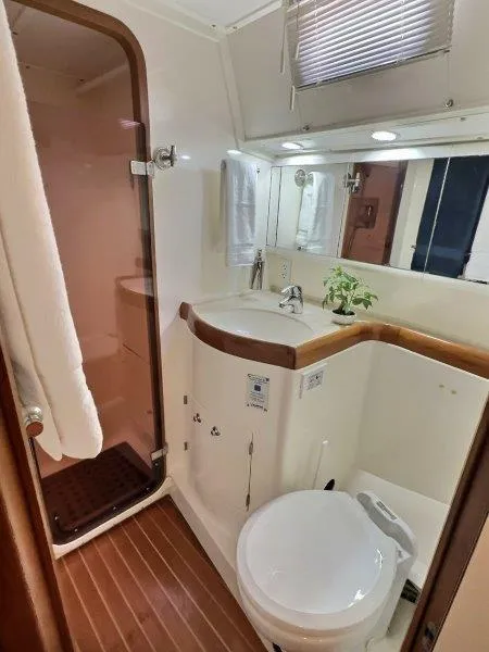 Slide: The Image of 2003 Taswell 58 yacht bathroom with shower, sink, and toilet. - 30