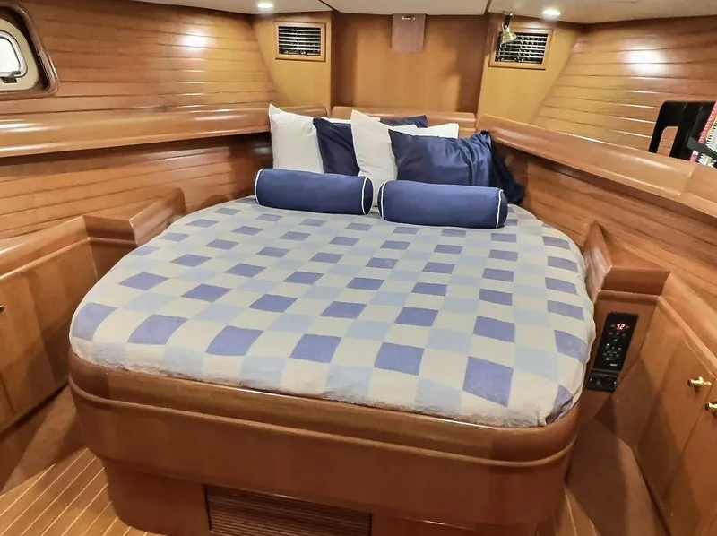 Slide: The Image of Luxurious cabin interior of 2003 Taswell 58 yacht with cozy bed and wooden finish. - 31