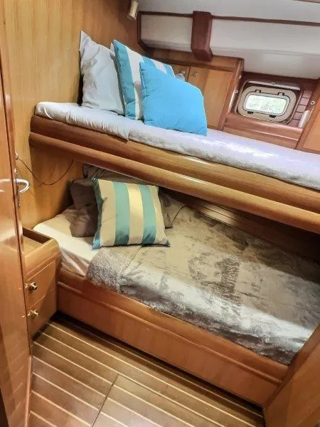 Slide: The Image of Cozy cabin interior of 2003 Taswell 58 yacht with bunk beds and wooden finish. - 32