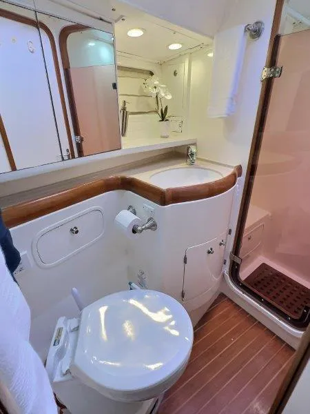 Slide: The Image of Luxurious bathroom in 2003 Taswell 58 yacht with modern fixtures and wooden accents. - 33