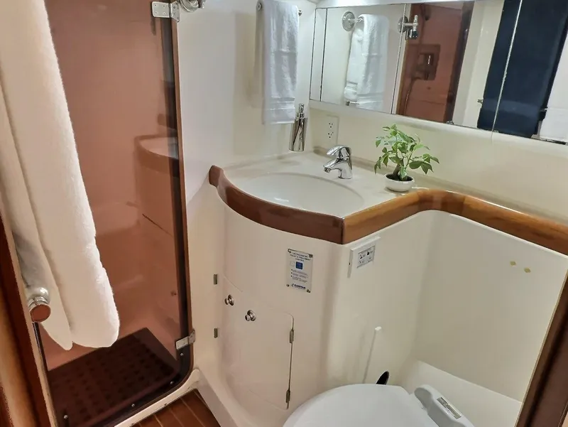 Slide: The Image of Luxurious bathroom in 2003 Taswell 58 yacht with modern fixtures and elegant design. - 34