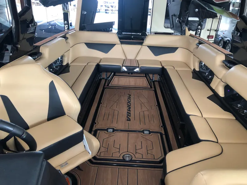 Slide: The Image of 2023 Moomba Makai boat interior with tan seating and sleek design. - 26