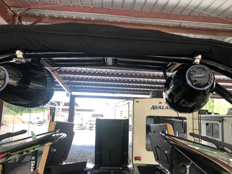 Slide: The Image of 2023 Moomba Makai boat speakers under metal roof in storage. - 37