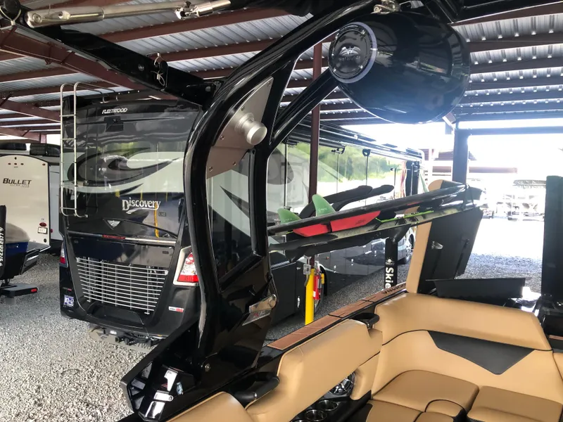 Slide: The Image of 2023 Moomba Makai boat in storage, featuring sleek design and modern amenities. - 38