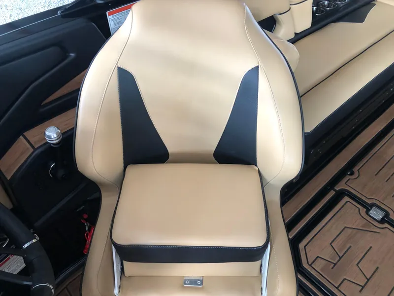 Slide: The Image of 2023 Moomba Makai boat interior with tan and black seating. - 40