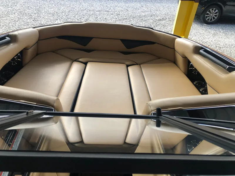 Slide: The Image of 2023 Moomba Makai boat interior with beige seating and sleek design. - 44