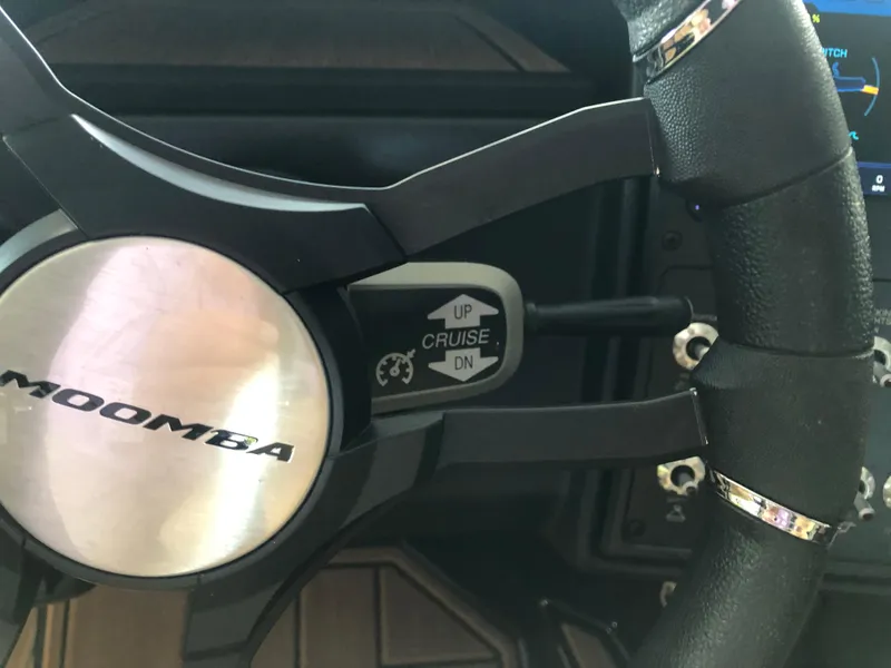 Slide: The Image of 2023 Moomba Makai steering wheel with cruise control feature. - 47