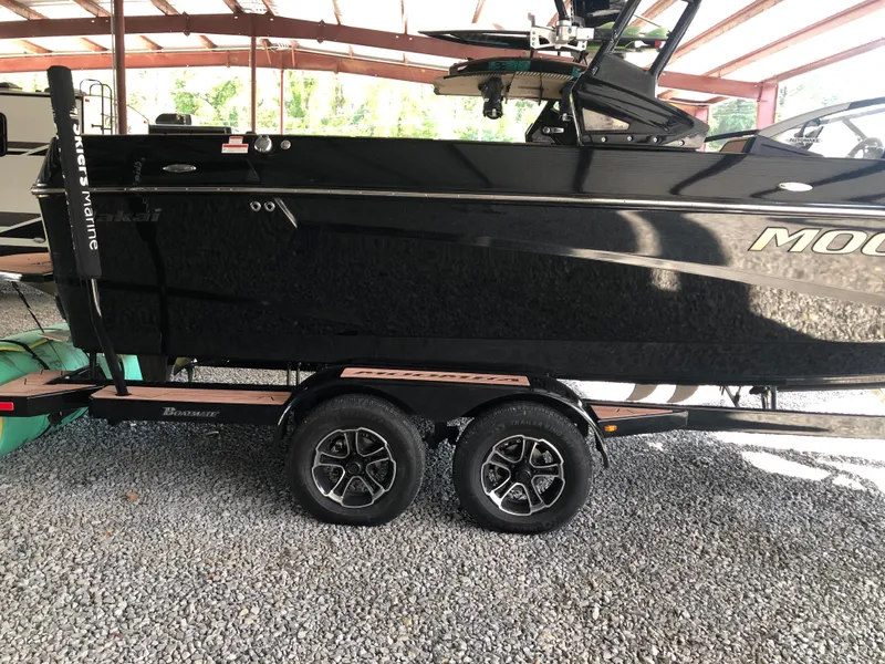 Slide: The Image of 2023 Moomba Makai boat on trailer in covered storage area. - 5