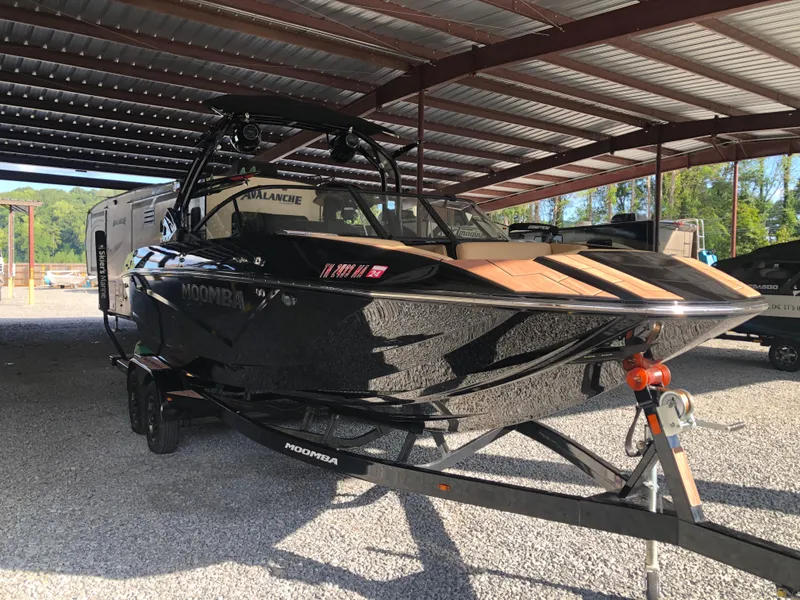 Slide: The Image of 2023 Moomba Makai boat on trailer in covered storage area. - 9