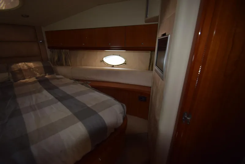 Slide: The Image of Interior cabin of 2005 Sunseeker Manhattan 50 yacht with bed and porthole. - 13