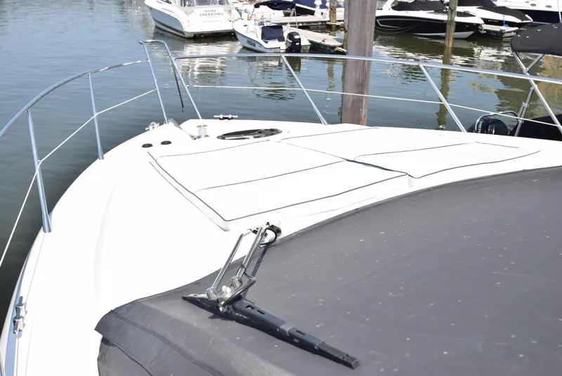 Slide: The Image of 2005 Sunseeker Manhattan 50 yacht bow view at marina. - 22