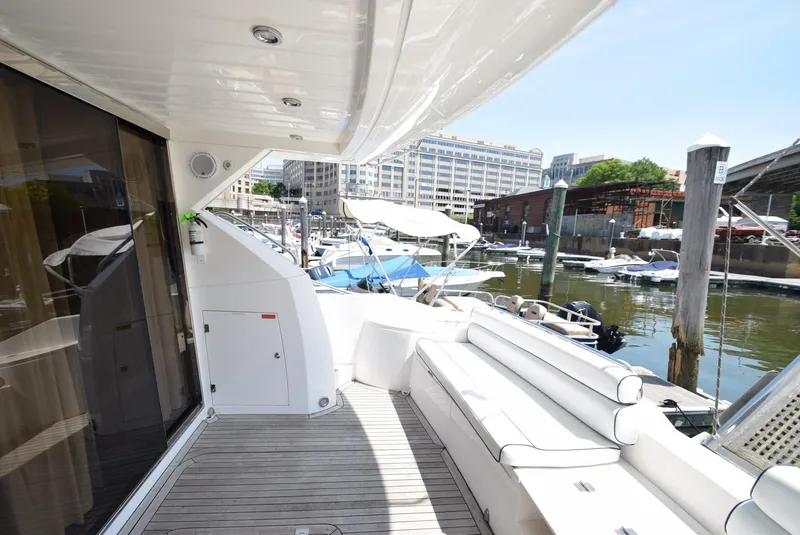 Slide: The Image of 2005 Sunseeker Manhattan 50 yacht docked, featuring spacious deck and modern amenities. - 23