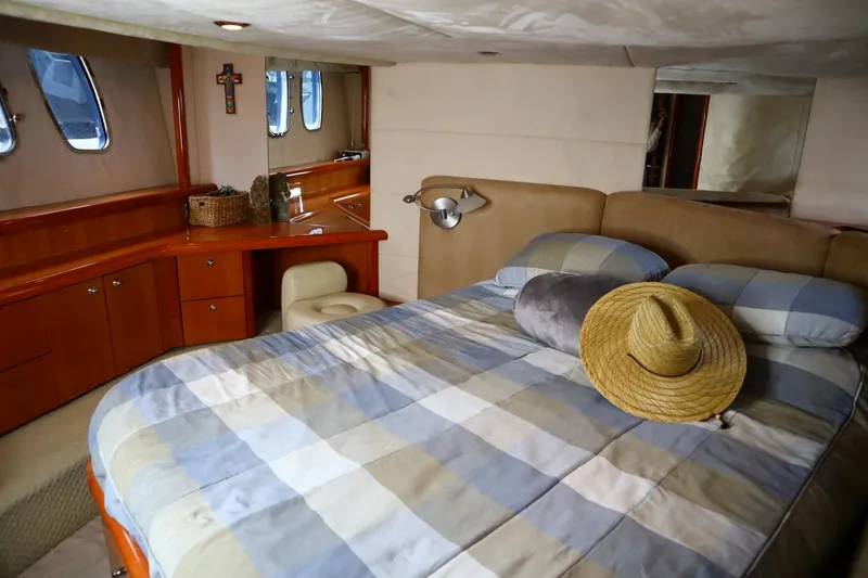 Slide: The Image of Interior cabin of 2005 Sunseeker Manhattan 50 yacht with bed and desk. - 24