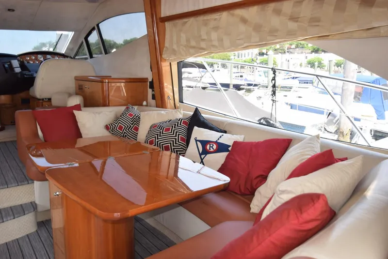 Slide: The Image of Interior of 2005 Sunseeker Manhattan 50 yacht with plush seating and wooden table. - 5