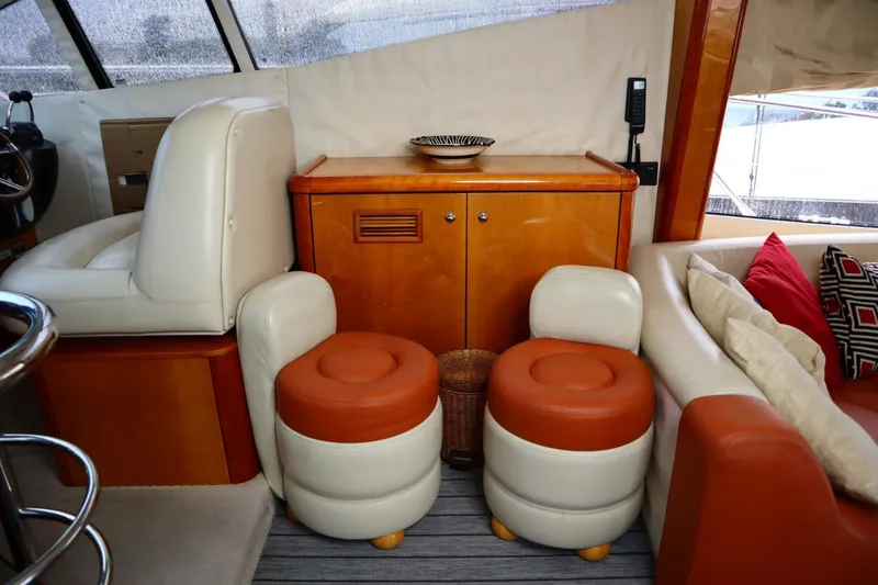 Slide: The Image of Interior of 2005 Sunseeker Manhattan 50 yacht with leather seating and wooden cabinetry. - 6